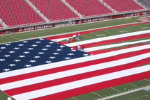 Huge American Flag Being Setup on Football Field
